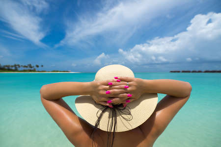 woman in hat on the beachの写真素材