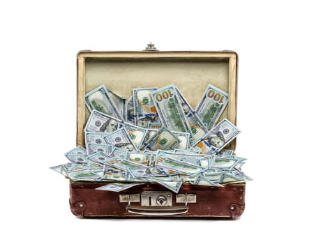 Open old vintage suitcase full of money, business conceptの写真素材
