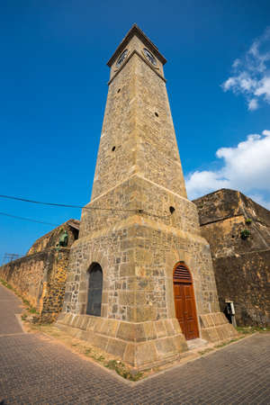 Colonial fine condition building development of the fort Galle on Sri Lanka. The photograph is presenting Galle fort clock towers on walls of the fort Sri Lankaの写真素材