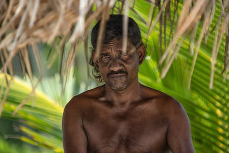 GALLE, Sri Lanka - DECEMBER 30, 2016: Rural residents in daily life. Eyes in which the world... Closeup portrait of an old fishermanin Galle, Sri Lankaのeditorial素材