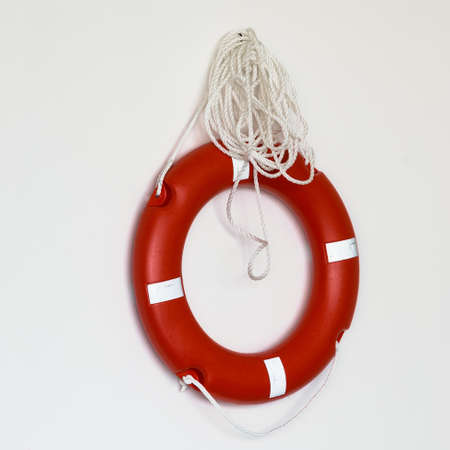 Red lifebuoy isolated over white backgroundの写真素材