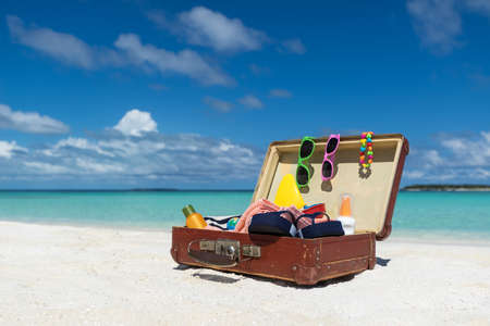Beach Accessories In Suitcase On Beach - Travel Conceptの写真素材