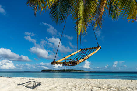 Beautiful beach. View of nice tropical beach with palms around. Holiday and vacation concept. Tropical beach.の写真素材