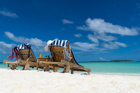 Picture of wooden beach chairs on the tropical beach, vacation. Traveler dreams conceptの写真素材