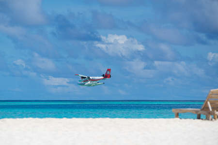 Male, Maldives  - June 22, 2017 : Seaplane air taxi fly over Atolls in Indian Ocean To transfer...