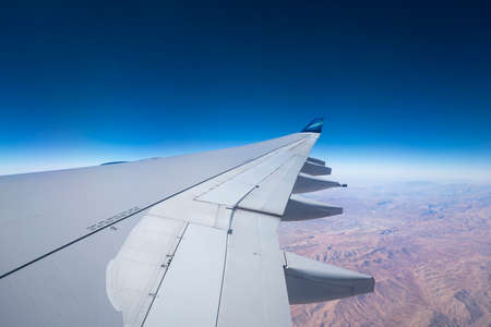 Baku, Azerbaijan - DECEMBER 31,2017: View of in wing airplane  AZAL Azerbaijan Airlines  in flightのeditorial素材