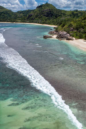 Tropical beach with sea and palm taken from drone. Beach and sea photo. Romantic beach aerial view.のeditorial素材