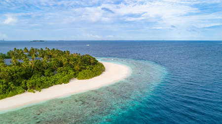 Aerial view of beautiful island at Maldives in the Indian Ocean. Top view from drone.の写真素材