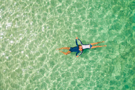 Romantic couple snorkeling in the sea in honeymoon