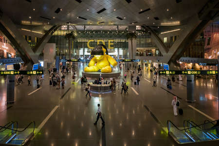DOHA, QATAR - NOVEMBER 23, 2019: Interior of Hamad International Airport in Doha, Qatar. Base airport are airlines: Qatar Airways.のeditorial素材