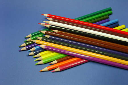 colored pencils on a blue backgroundの写真素材