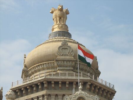 An Indian building with a flag in front of itの写真素材