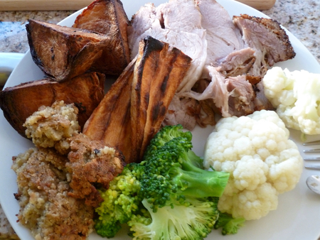 Hot roast dinner with pork and vegetablesの写真素材