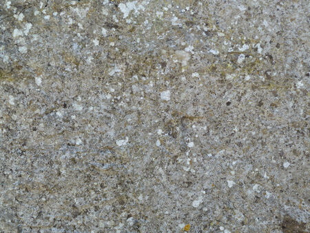 Hard light grey stone surface on a patch of wallの写真素材