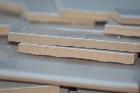 broken white tiles in a pile