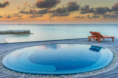 Sunset over a  small pool in the Maldivesのeditorial素材