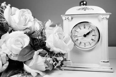 Porcelain vintage clock with roses in monochrome.の写真素材