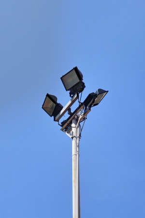 Spotlight pole with space on blue sky background