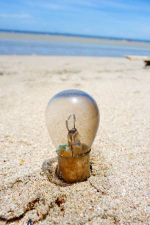 Light bulb on the beachの写真素材