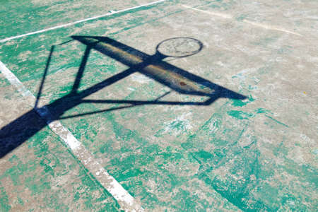 Concrete basketball court with shadow hoopの写真素材