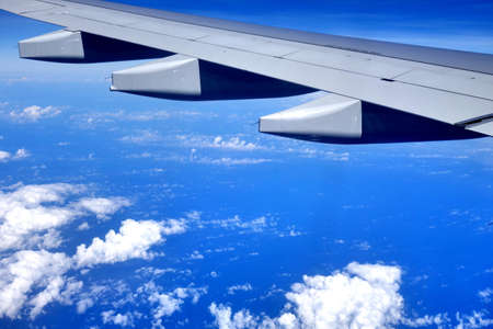 plane's wing and cloudscape