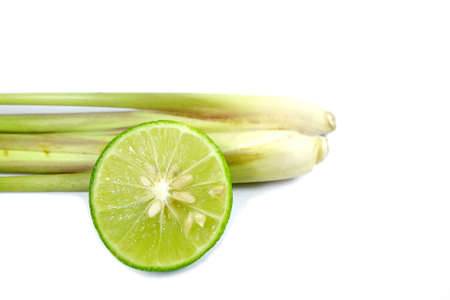 Slice of fresh lime and lemon grass on background.の写真素材