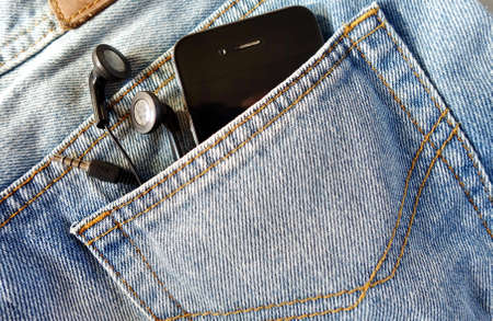 earphone and smartphone in jean pocketの写真素材