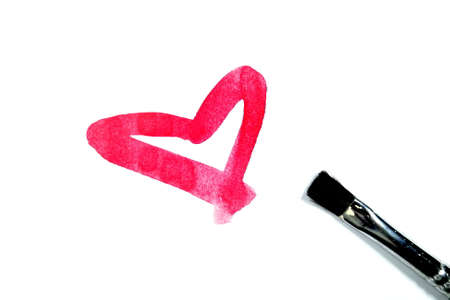 Brush drawing red heart shape, isolated on whiteの写真素材