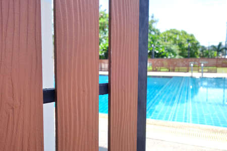 wooden door open to swimming pool in summer.の写真素材