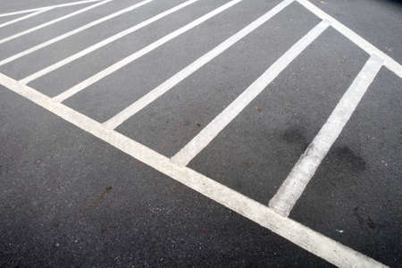 White line in empty parking lot for background.