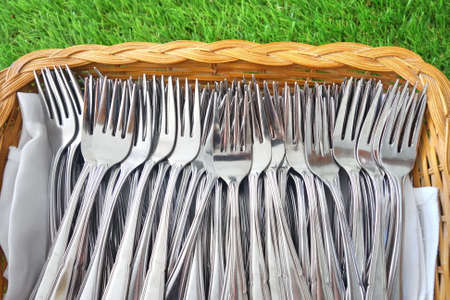 silverware, forks and spoons in basket.の写真素材