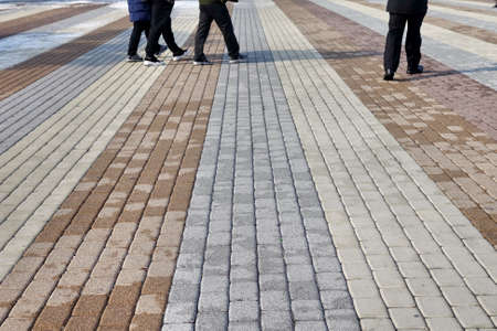 brick pathway with people walking onの写真素材