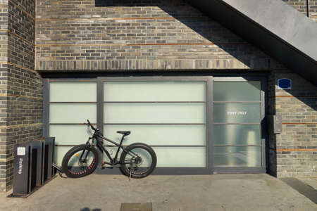 Bicycle in front of office buildingの写真素材