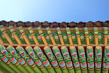 Traditional korean architecture roof with blue sky background.