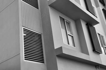 Windows on apartment building, monochromeの写真素材