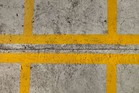 Yellow lines on concrete texture, bike parking space.の写真素材