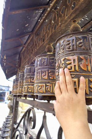Prayer wheels at temple in Kathmandu, Nepalの写真素材