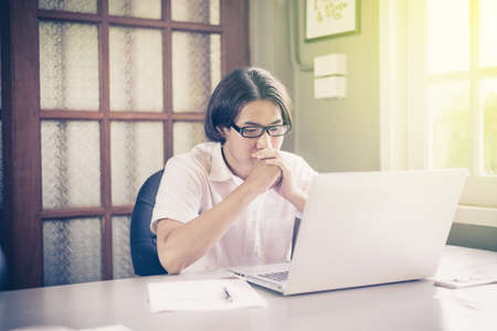 Businessman using ideas while working with labtop at officeの写真素材