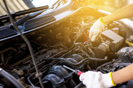 Closeup of hand mechanic engineer fixing car at garage,concept car maintenance