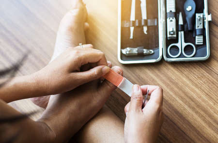 Woman using bandage or plaster on her footの写真素材