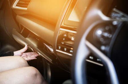 Hand open glove compartment box in carの写真素材