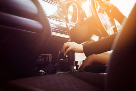 Hand woman on automatic gear shift,Close upの写真素材