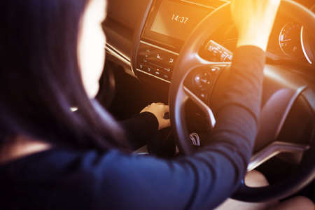 Hand woman on automatic gear shift,Close up