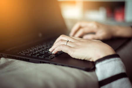 Close up hands woman working using laptop and connecting wifiの写真素材