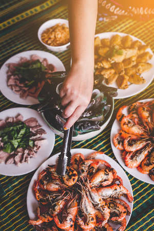 Hand with grilled shrimp,Delicious seafoodの写真素材