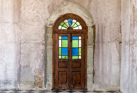 Old wooden door with metal door handle in old city の写真素材