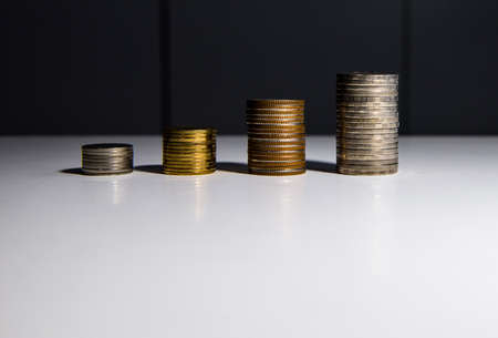 Coin stacks on a tableの写真素材