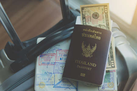 Passport with fight ticket on suitcase or luggageの写真素材