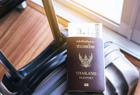 Passport with fight ticket on suitcase or luggageの写真素材