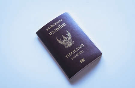 Passport with fight ticket on table